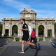 People run by the Puerta de Alcalá in Madrid, Spain. On Saturday, May 2, Spain eased its coronavirus lockdown and allowed people to go out and exercise for the first time in seven weeks.